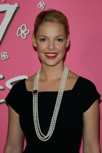 Katherine Heigl wearing a white triple strand pearl necklace